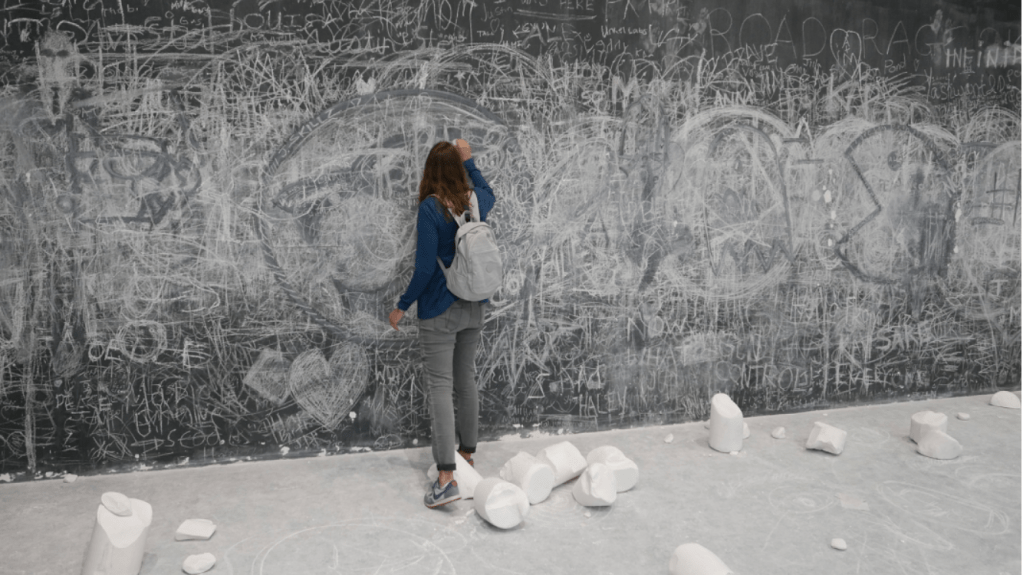 woman drawing on a wall